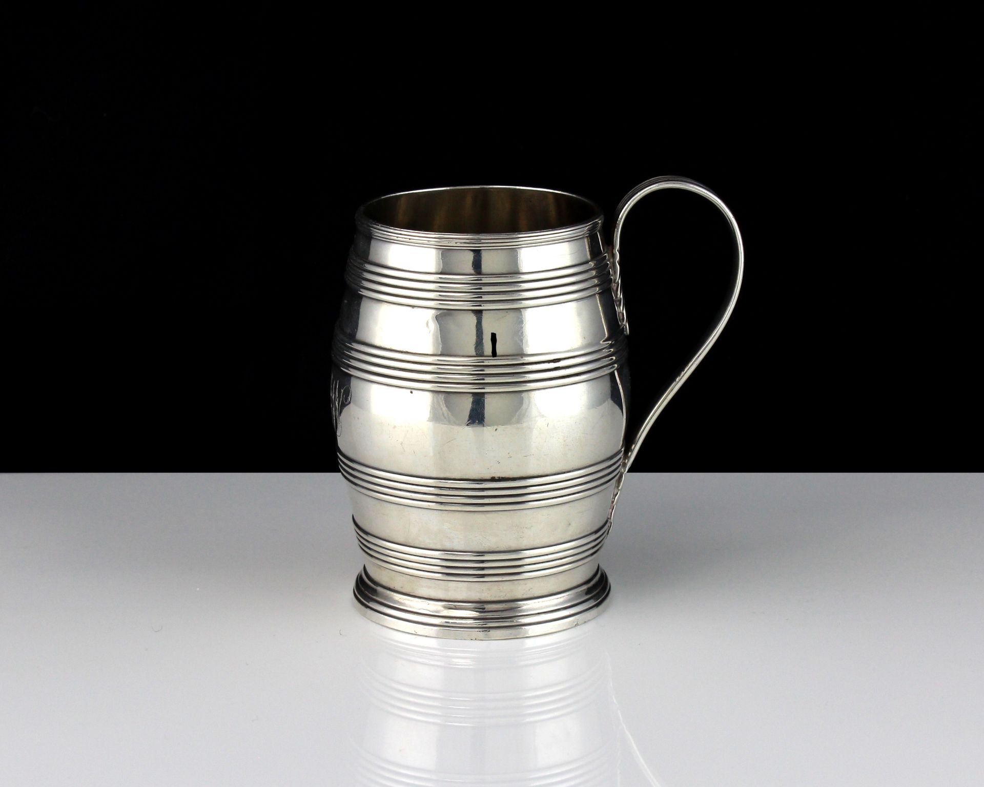 An antique George III Sterling Silver barrel mug by John Robins, London 1783 designed in the form of