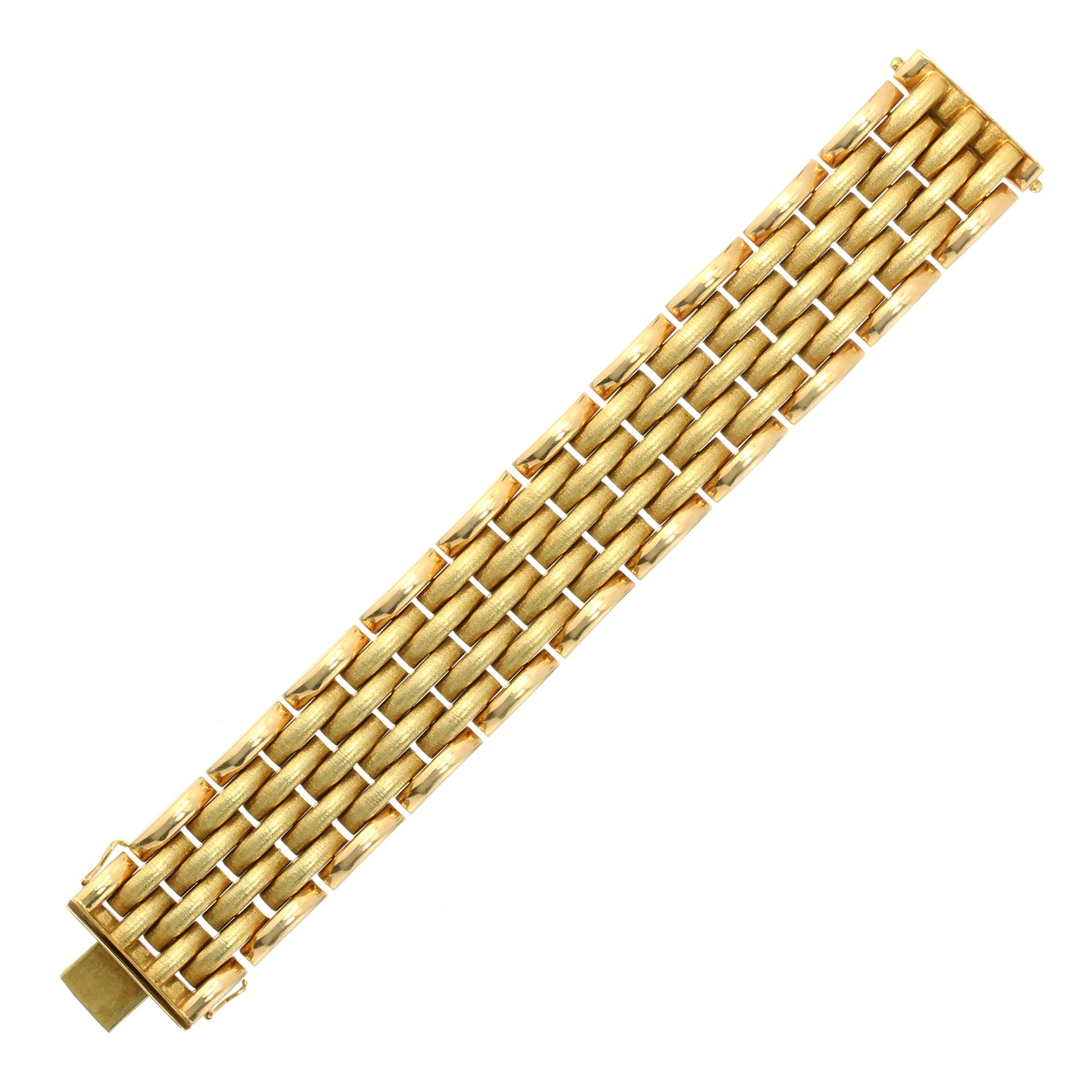 A FANCY LINK BRACELET designed as five rows of rounded matte textured links bordered by two