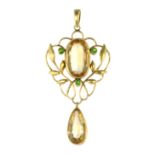 AN ART NOUVEAU IMPERIAL TOPAZ AND DEMANTOID GARNET PENDANT set with a central oval cut topaz of 4.43