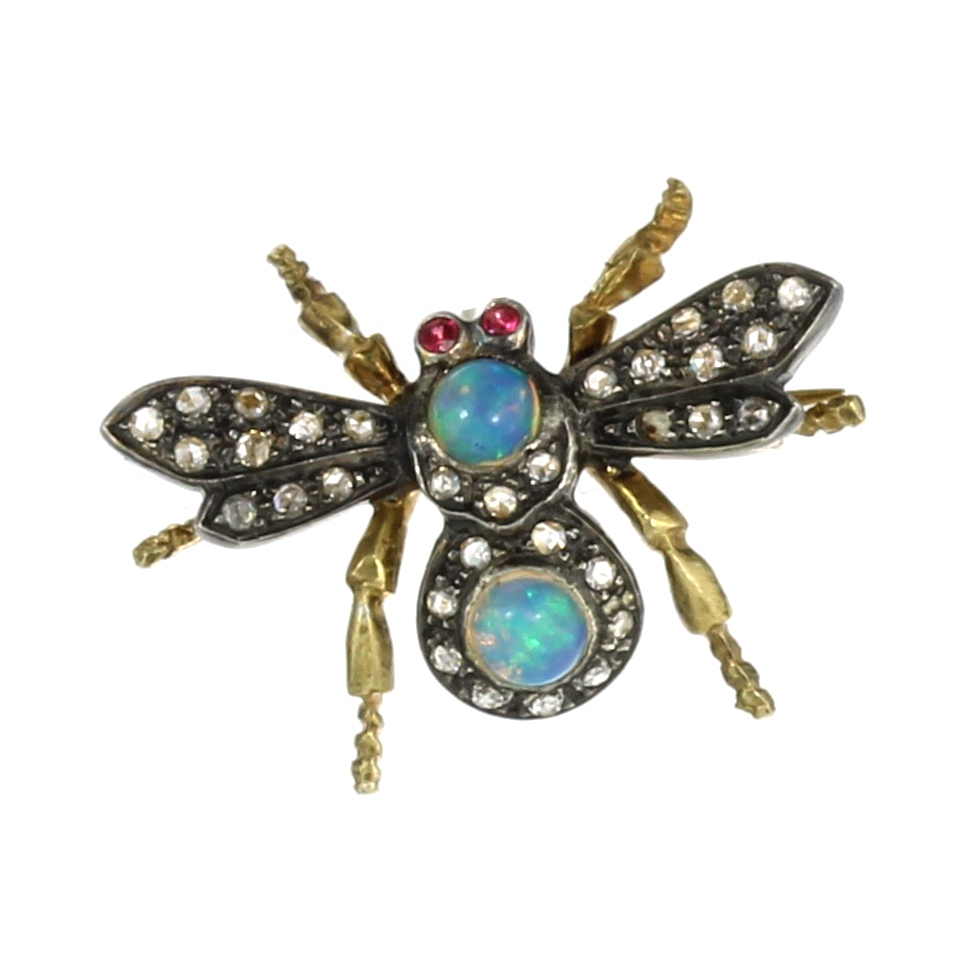 AN OPAL, RUBY AND DIAMOND BEE / INSECT BROOCH designed as a bee, its body jewelled with cabochon