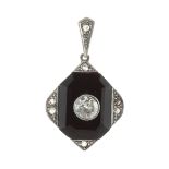 AN ANTIQUE ART DECO DIAMOND AND ONYX PENDANT set with a carved octagonal panel of onyx jewelled with