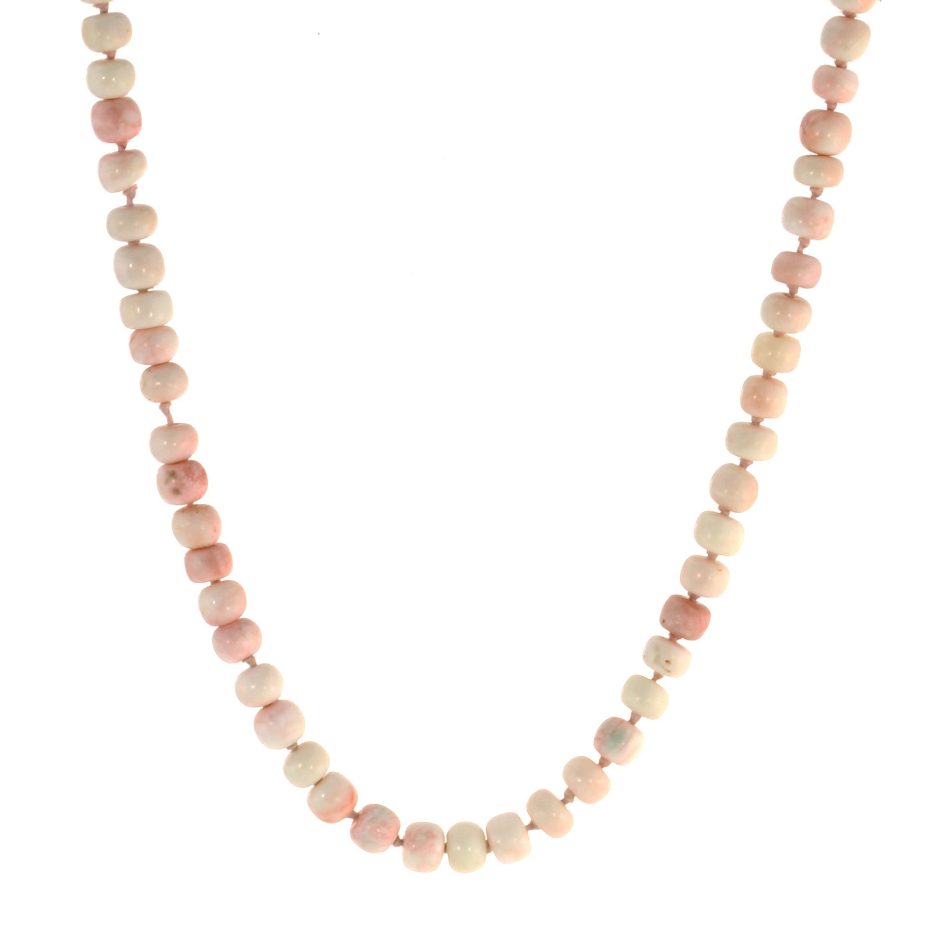 A CORAL BEAD NECKLACE comprising a single strand of eighty four polished coral beads, length 460mm.