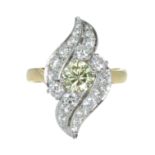 A YELLOW AND WHITE DIAMOND DRESS RING set with a central round cut yellow diamond of 0.82 carats