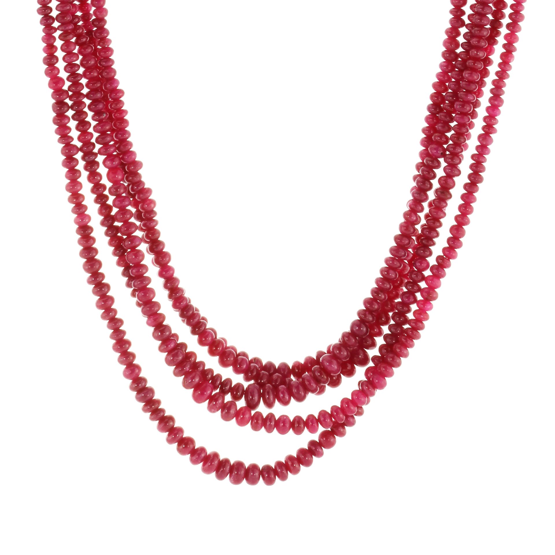 A FIVE STRAND RUBY NECKLACE comprising five rows of graduated polished ruby beads up to 6.5mm in