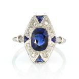 AN ART DECO CEYLON SAPPHIRE AND DIAMOND RING set with a central oval cut sapphire of 2.26 carats
