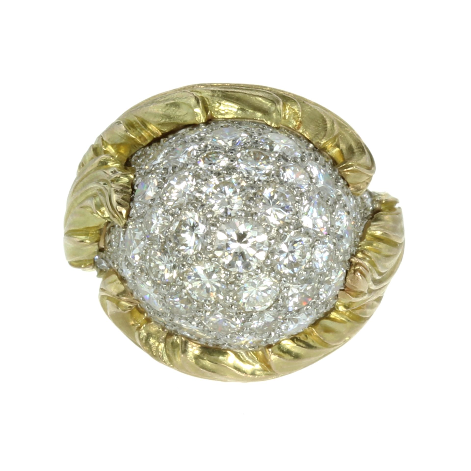 A DIAMOND COCKTAIL RING designed as a large bombe jewelled with 4.30 carats of round cut diamonds