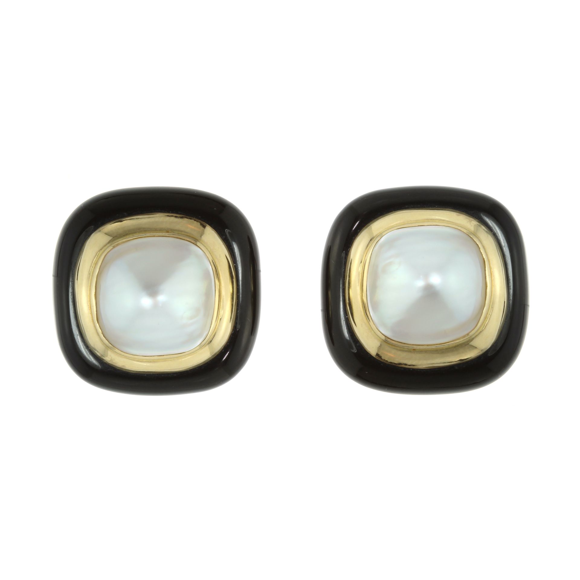 A PAIR OF PEARL AND BLACK ONYX CLIP EARRINGS each of cushion shape set with a large, central pearl