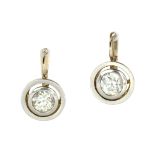 A PAIR OF ANTIQUE DIAMOND EARRINGS, EARLY 20TH CENTURY each set with an old round cut diamond of 1.