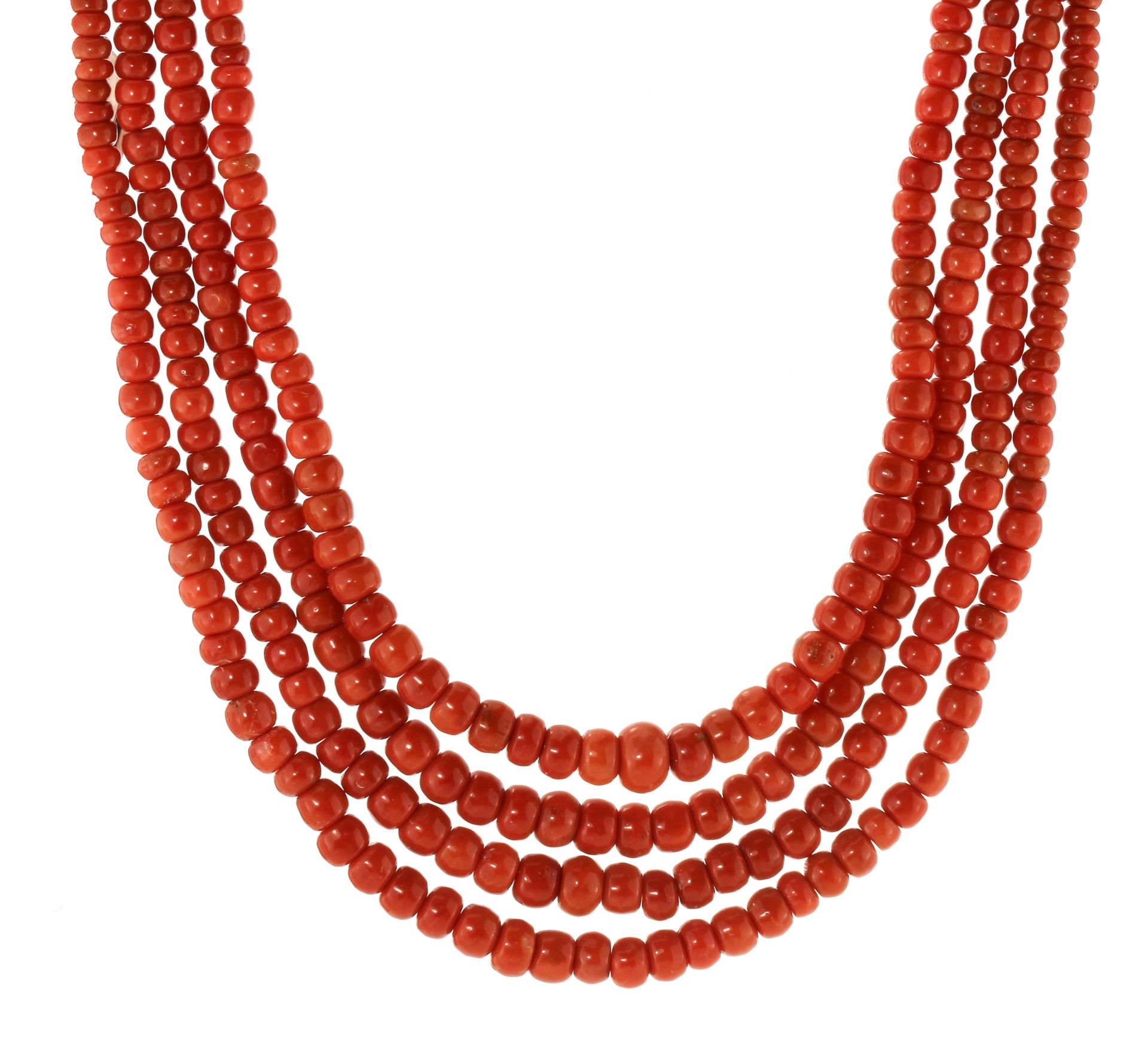 A FOUR STRAND CORAL BEAD NECKLACE comprising four rows of five hundred and ninety seven graduated