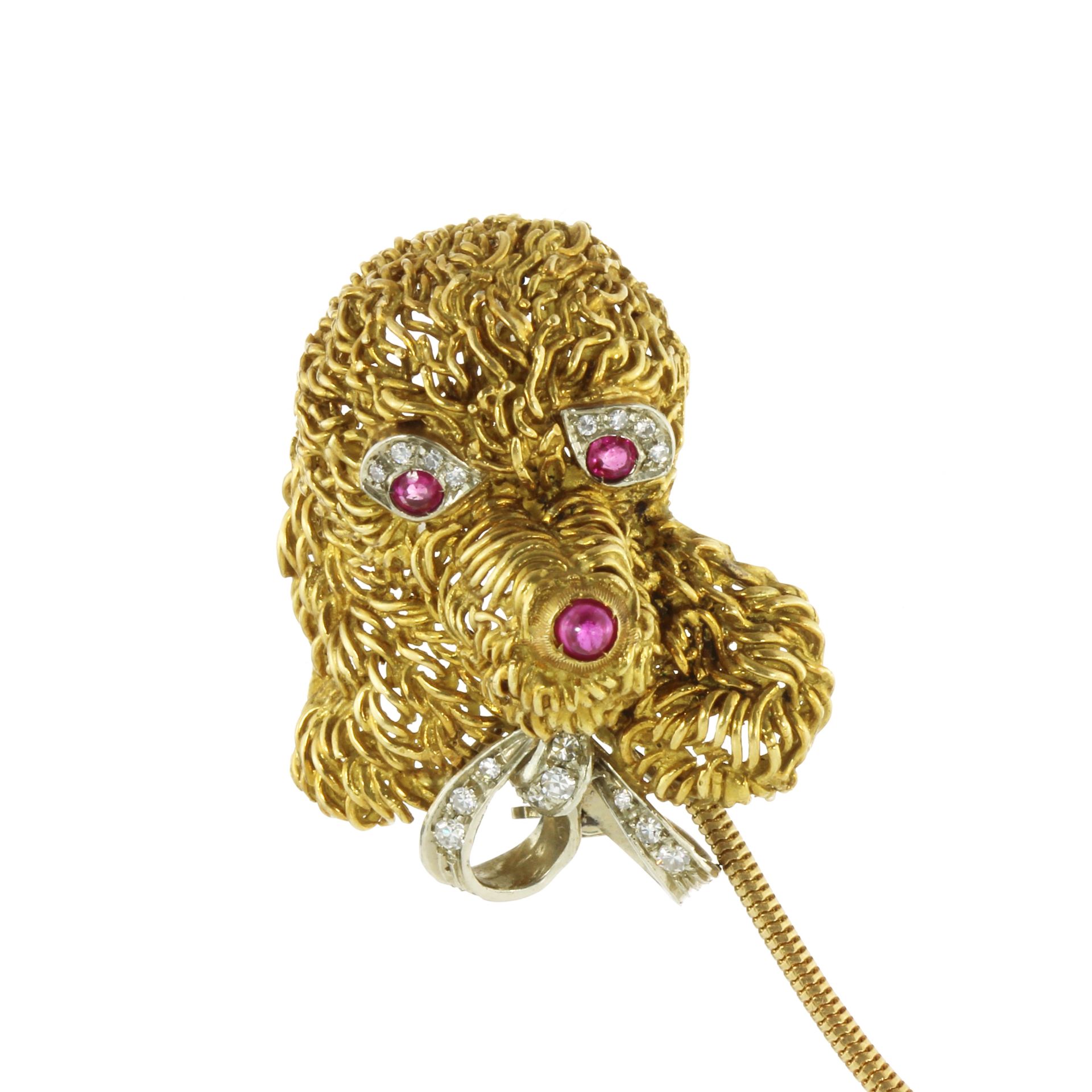 A RUBY AND DIAMOND DOG BROOCH, CIRCA 1980 designed to depict a toy poodle caricature, with ruby