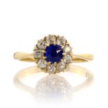 A SAPPHIRE AND DIAMOND DRESS RING, EARLY 20TH CENTURY set with a central old cut blue sapphire