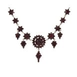 AN ANTIQUE GARNET NECKLACE, 19TH CENTURY comprising a single row of floral garnet clusters, with a