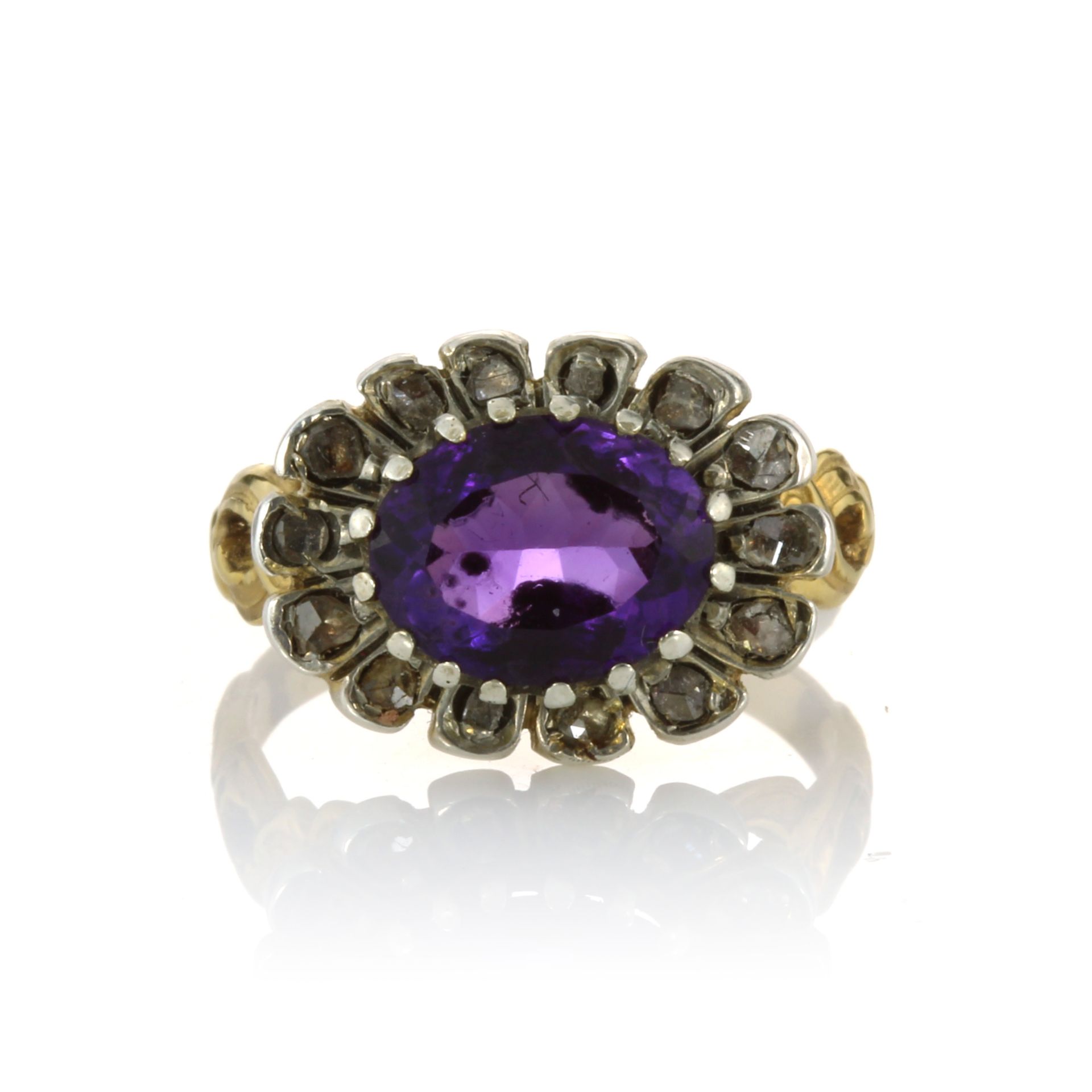 AN ANTIQUE AMETHYST AND DIAMOND DRESS RING, 19TH CENTURY set with an oval cut amethyst surrounded by