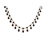 AN GARNET RIVIERA NECKLACE, 19TH CENTURY comprising a single row of alternating flat, round cut