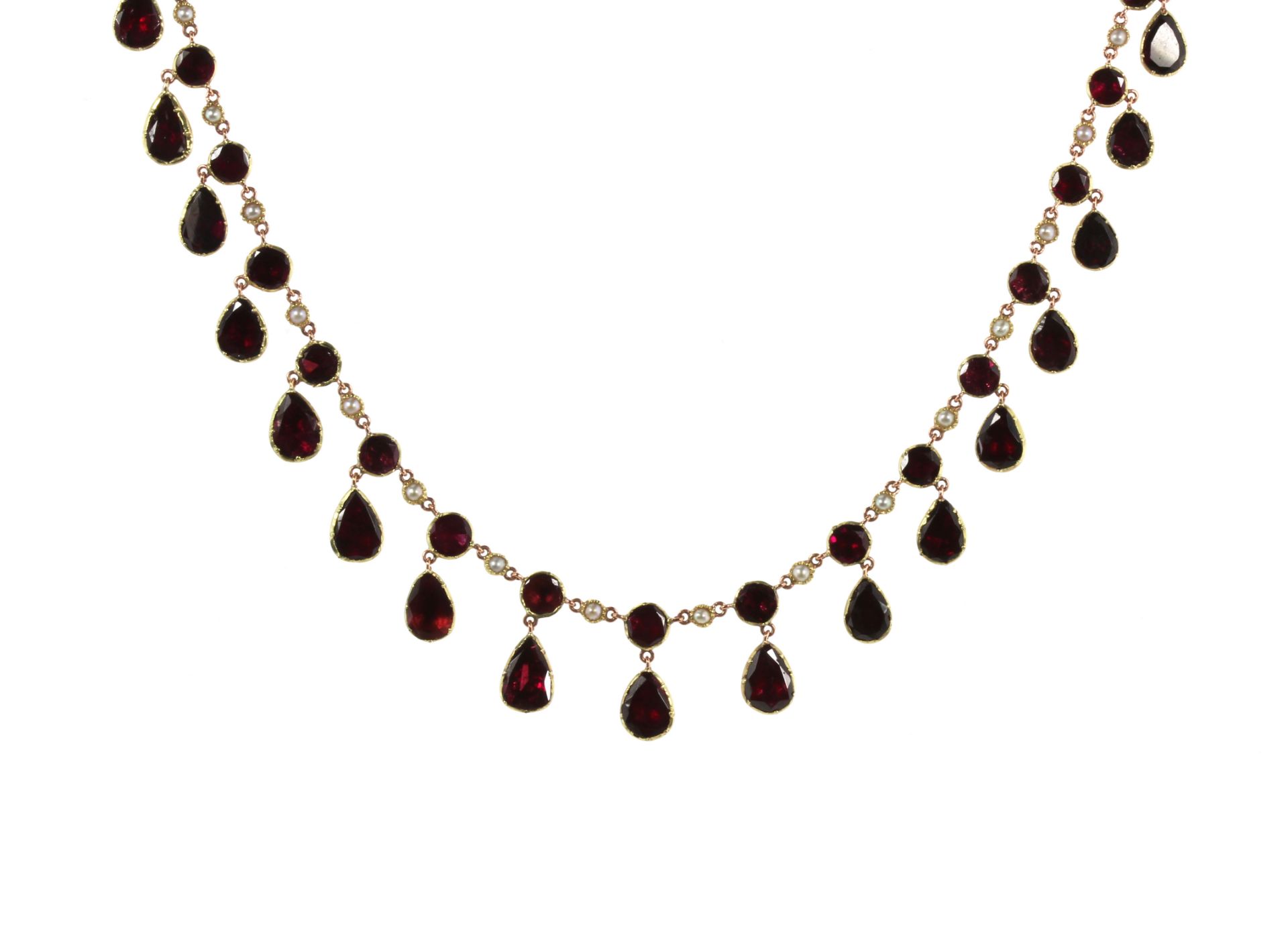 AN GARNET RIVIERA NECKLACE, 19TH CENTURY comprising a single row of alternating flat, round cut