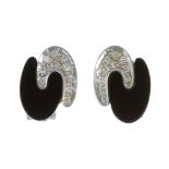 A PAIR OF ONYX AND DIAMOND CLIP EARRINGS, CIRCA 1973 each designed as two interlocking motifs, one