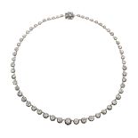 AN ANTIQUE DIAMOND RIVIERA NECKLACE, LATE 19TH CENTURY designed as a single row of fifty seven old