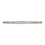 AN ANTIQUE DIAMOND BAR BROOCH designed as a single row of twenty one graduated old cut diamonds, 6.