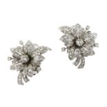 A PAIR OF DIAMOND EARRINGS, CIRCA 1950 each designed as a flower set at the centre with an old round