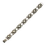 A FANCY LINK BRACELET, N E FROM, DANISH MID 20TH CENTURY designed as seven rounded rectangular links