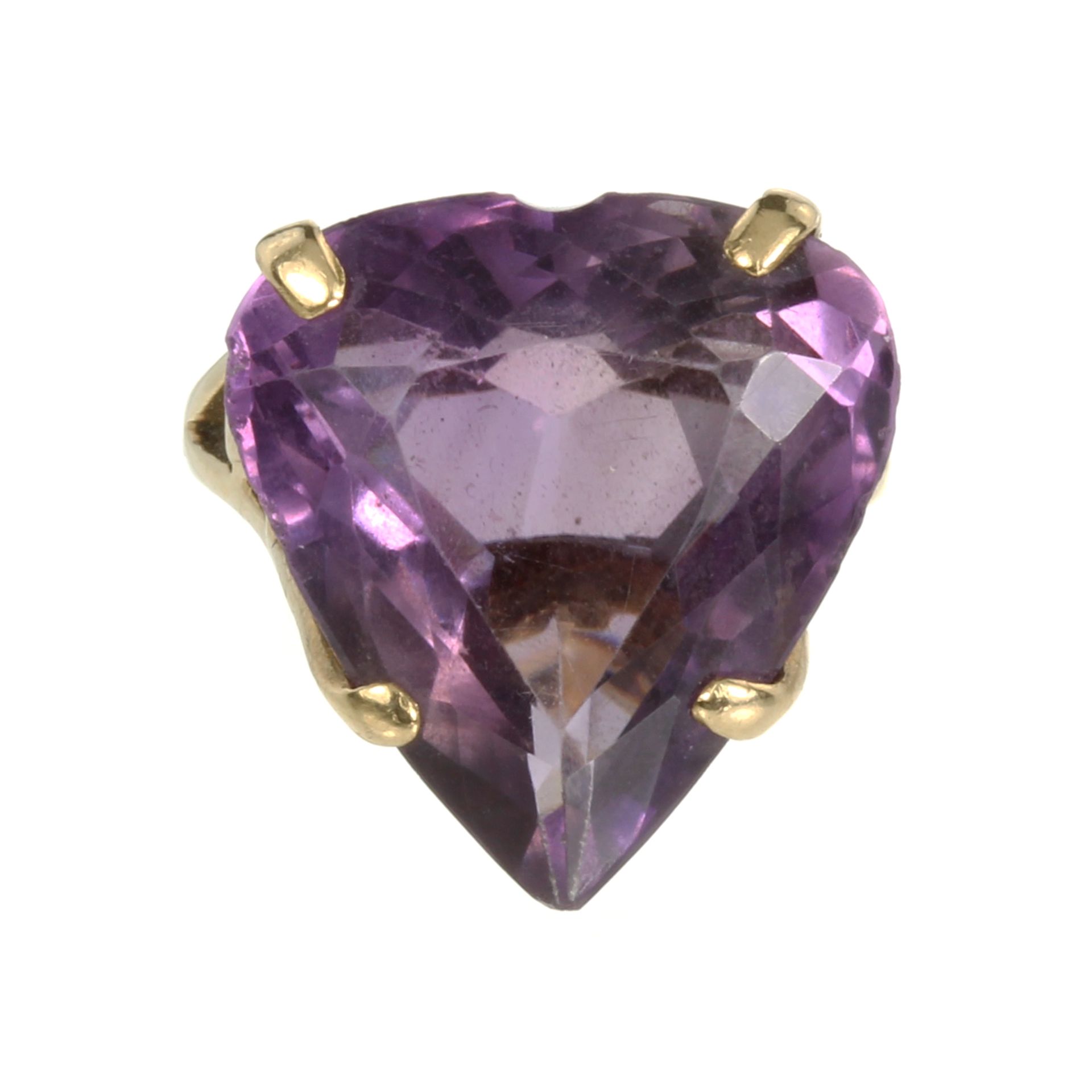 AN AMETHYST HEART DRESS RING set with a large heart cut amethyst in a galleried mount. Ring size