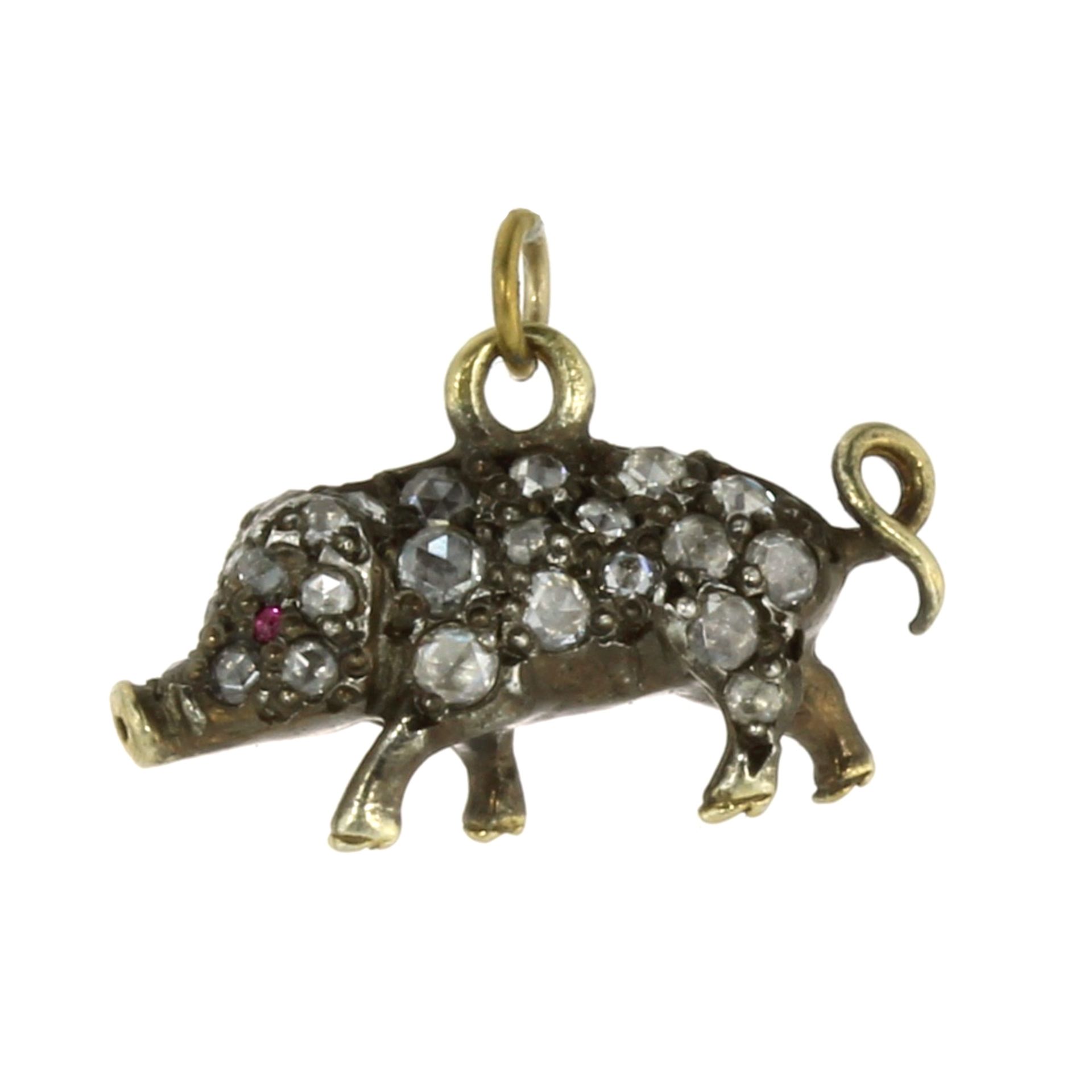 A DIAMOND AND RUBY PIG / PIGLET PENDANT OR CHARM designed as a pig, its body jewelled all over