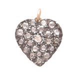 A DIAMOND HEART PENDANT designed as a heart, jewelled to the front with twenty-three rose cut
