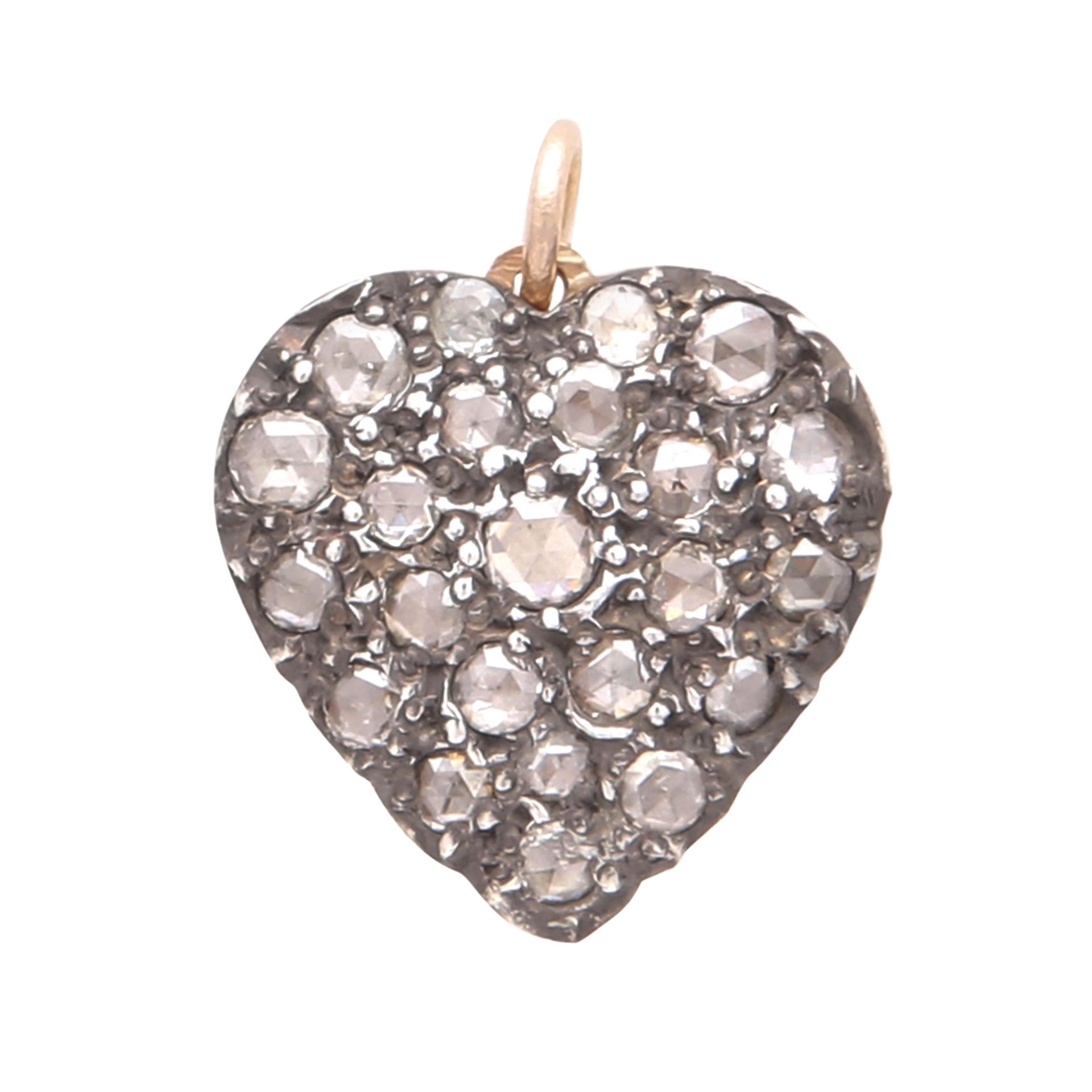 A DIAMOND HEART PENDANT designed as a heart, jewelled to the front with twenty-three rose cut