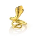 A DIAMOND SNAKE / SERPENT RING, CIRCA 1970 designed as a snake, its body coiled back on itself, with