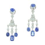 A PAIR OF SAPPHIRE AND DIAMOND EARRINGS each designed as three oval cut blue sapphires suspended