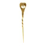 A PEARL COBRA / SNAKE STICK / TIE PIN designed as the head of a cobra atop a twisted pin, holding