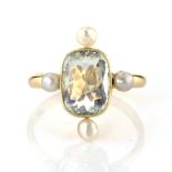 AN ANTIQUE AQUAMARINE AND PEARL DRESS RING set with a central cushion cut aquamarine flanked by four