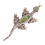 AN ANTIQUE DEMANTOID GARNET AND DIAMOND LIZARD BROOCH designed as a lizard, its body jewelled with a