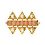 AN ANGEL CORAL AND PEARL BROOCH set with a single row of angel coral cabochons flanked above and