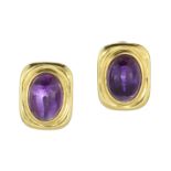 A PAIR OF AMETHYST CLIP EARRINGS, CIRCA 1970 each set with a large oval cabochon amethyst of 15.10