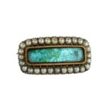 AN ANTIQUE SEED PEARL MOURNING BROOCH, 19TH CENTURY of rounded rectangular form with glass covered