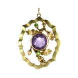 AN AMETHYST AND DEMANTOID GARNET PENDANT, 19TH CENTURY set with a round cut amethyst surrounded by