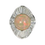 AN OPAL AND DIAMOND COCKTAIL RING set with a circular cabochon opal of 8.51cts encircled by an