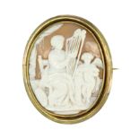 A CARVED CAMEO BROOCH, EARLY 20TH CENTURY set with a central oval carved cameo depicting a lady