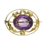 AN ANTIQUE SCOTTISH AMETHYST THISTLE BROOCH set with a large oval cut amethyst of 15.35 carats