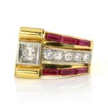 A DIAMOND AND RUBY COCKTAIL RING, CIRCA 1940 designed as a row of five small and one big round cut