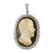 AN ANTIQUE CAMEO AND DIAMOND PENDANT in white gold or platinum, set with an oval cameo, carved in