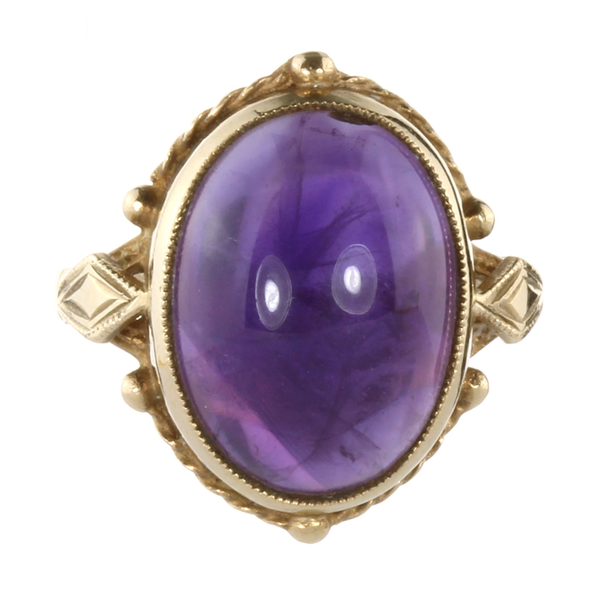 A VINTAGE AMETHYST DRESS RING, 1972 in yellow gold set with an oval cabochon amethyst of 8.70