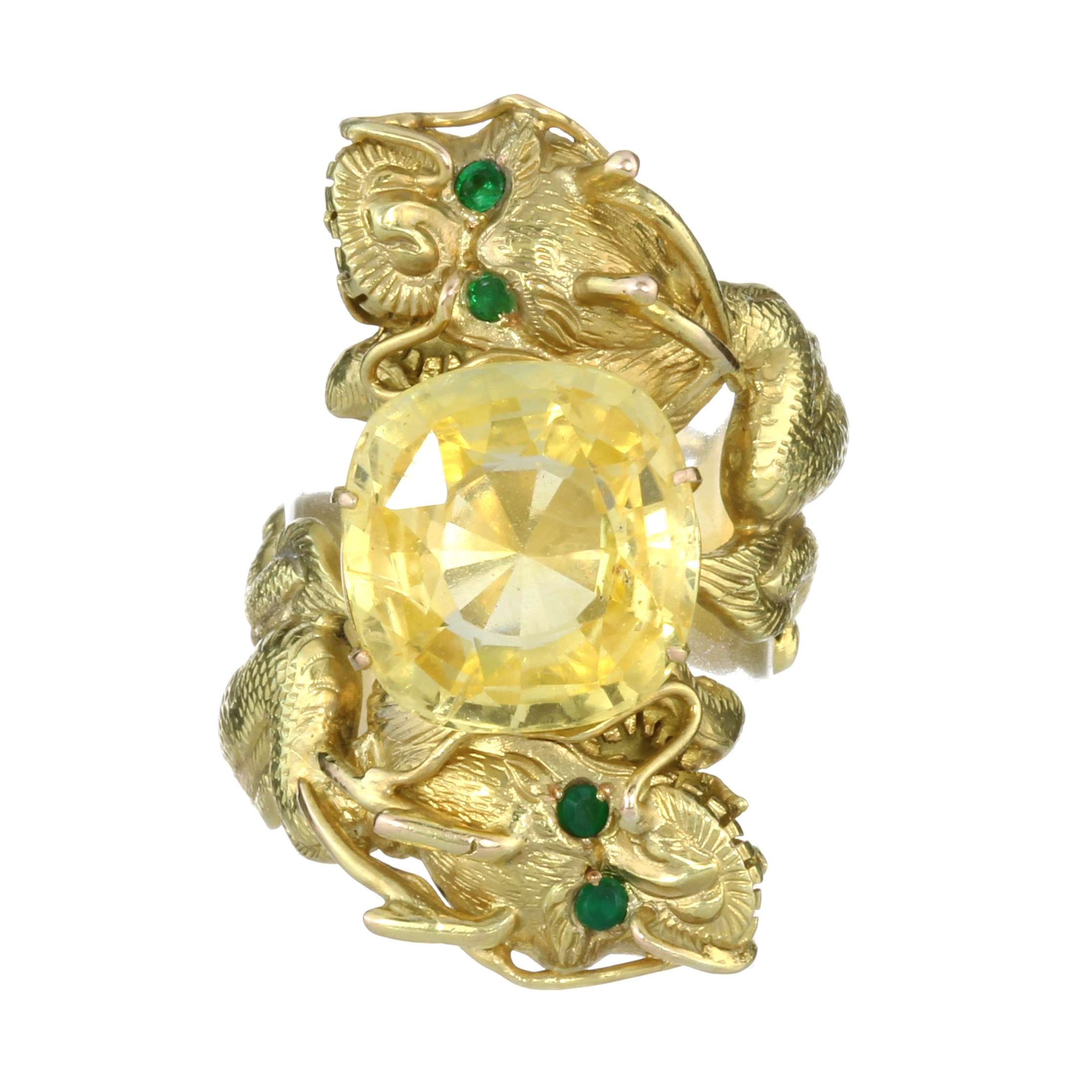 A 10.84 CARAT CEYLON NO HEAT YELLOW SAPPHIRE CHINESE DRAGON RING in yellow gold designed as two
