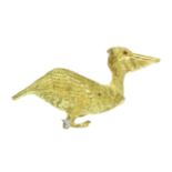 A RUBY AND DIAMOND PELICAN BROOCH, MAURICE GUYOT in 18ct yellow gold, in the form of a pelican, cast