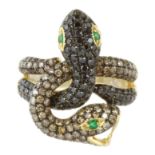 A COLOURED DIAMOND AND EMERALD DOUBLE SNAKE RING in 18ct yellow gold designed as two serpents, their