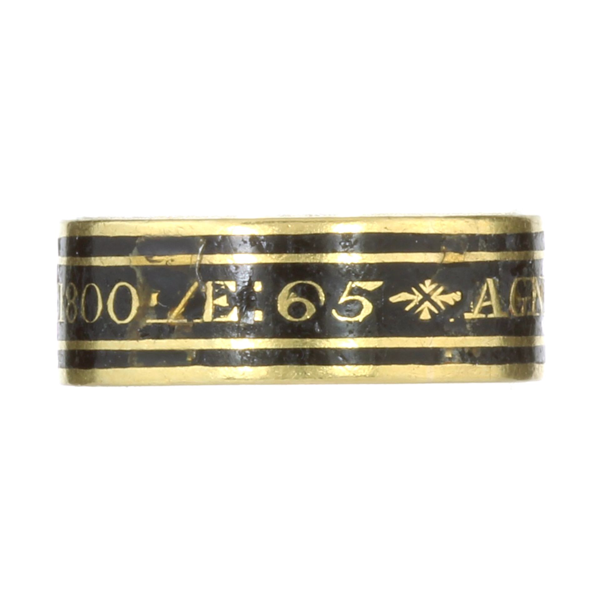 AN ANTIQUE GEORGIAN ENAMEL MOURNING RING, 1799 in high carat yellow gold the band decorated with