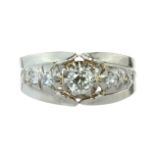 AN ANTIQUE DIAMOND DRESS RING in white gold or platinum, set with a central transitional cut stone