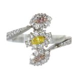 A FANCY PINK, YELLOW AND WHITE DIAMOND DRESS RING in platinum and 18ct white gold, set with a