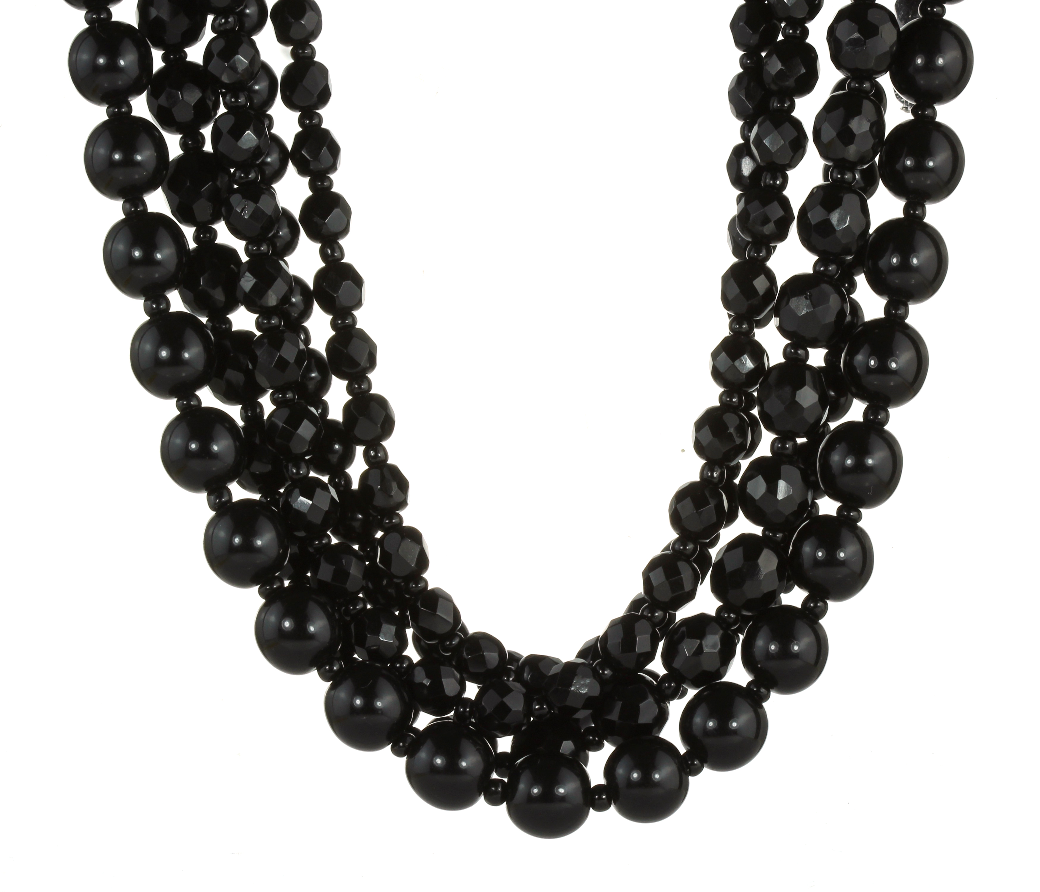 AN ANTIQUE JET BEAD NECKLACE comprising five rows of graduated polished and carved jet beads with